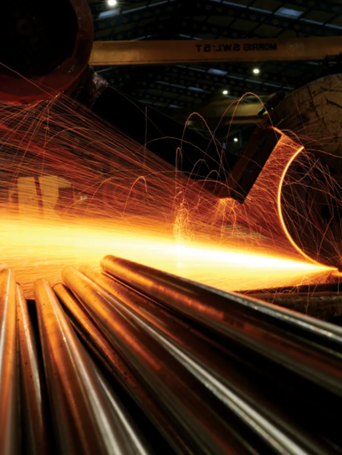 2019: sparks arcing off stainless steel bars in the mill