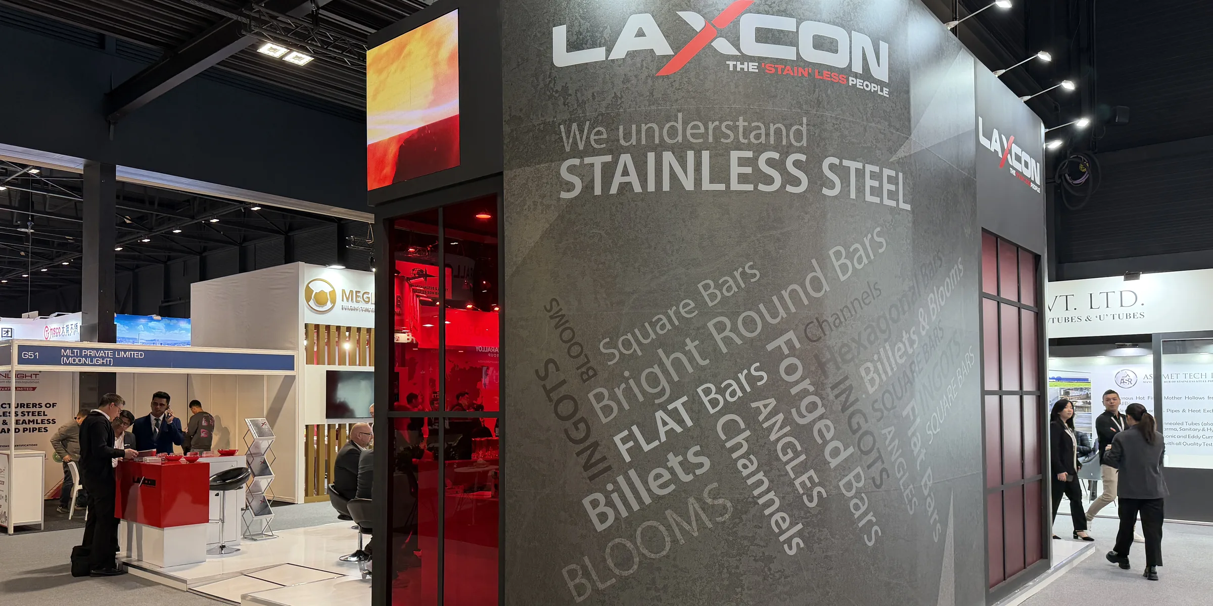 The Laxcon Steels stand at Stainless Steel World Expo 2025, product names printed across the curved fascia