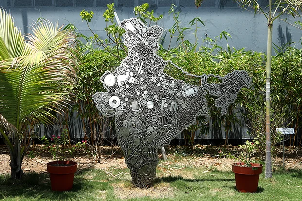 Map of India cut from stainless steel, standing in the garden