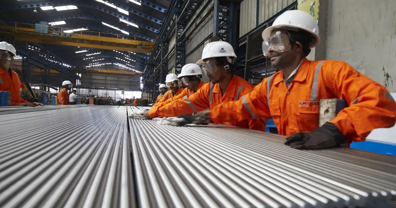 Team working along a line of bright bars